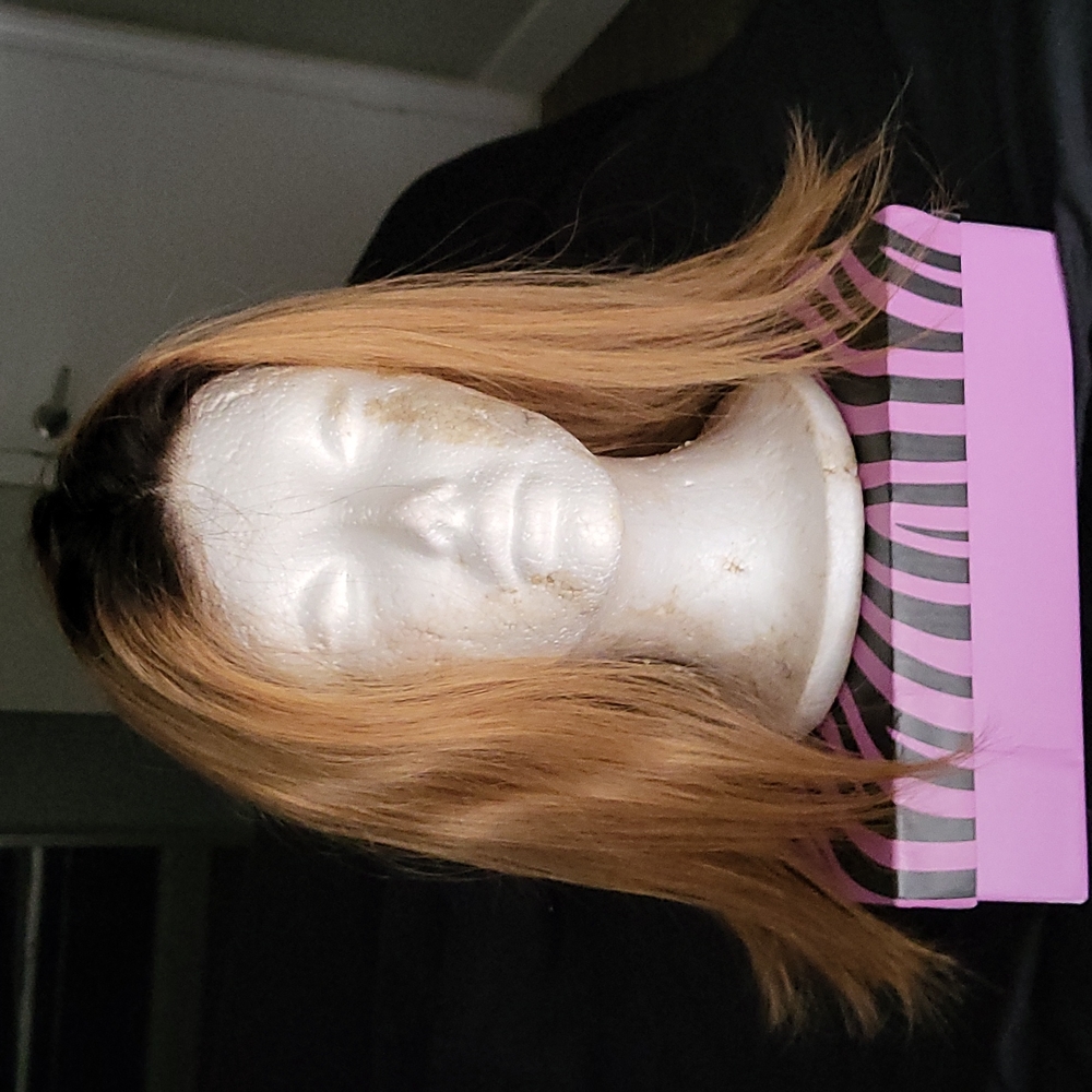One 100% human hair lace front blonde rooted wig.